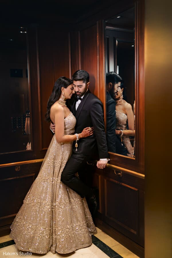 Shameem and Amit sharing a quiet moment in their wedding attire